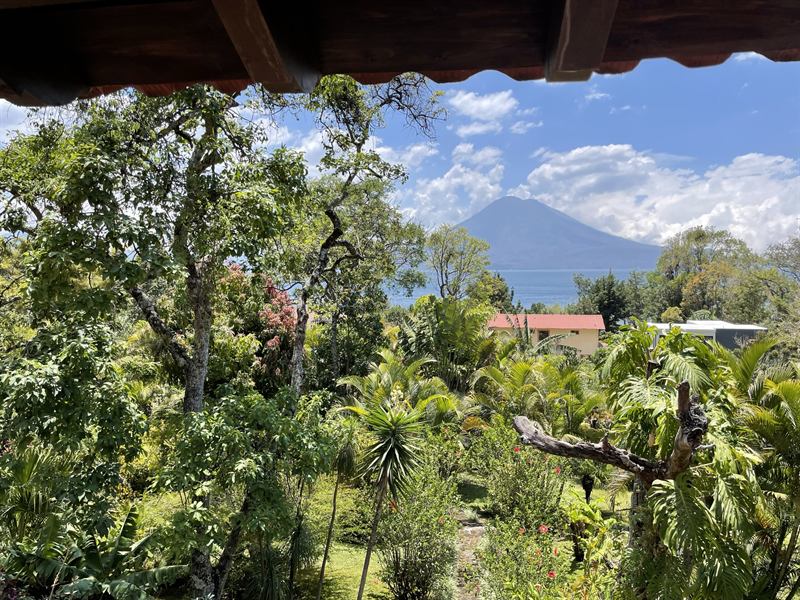 Lake Atitlán and a volcano seen over the villa garden